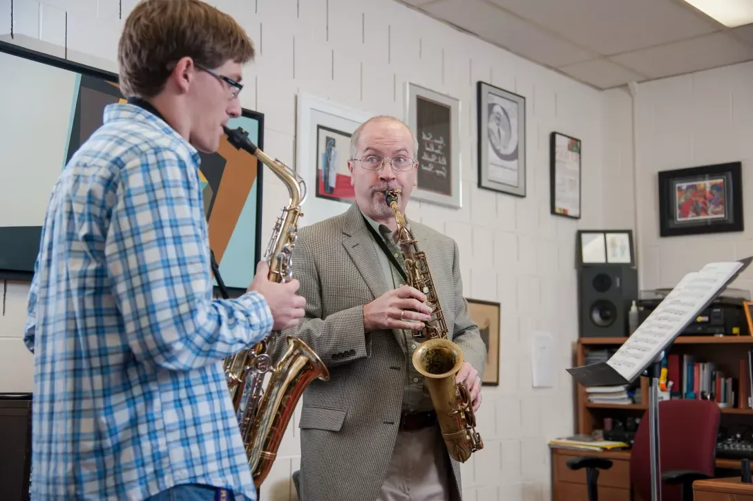 Tom Reed giving a saxaphone lesson